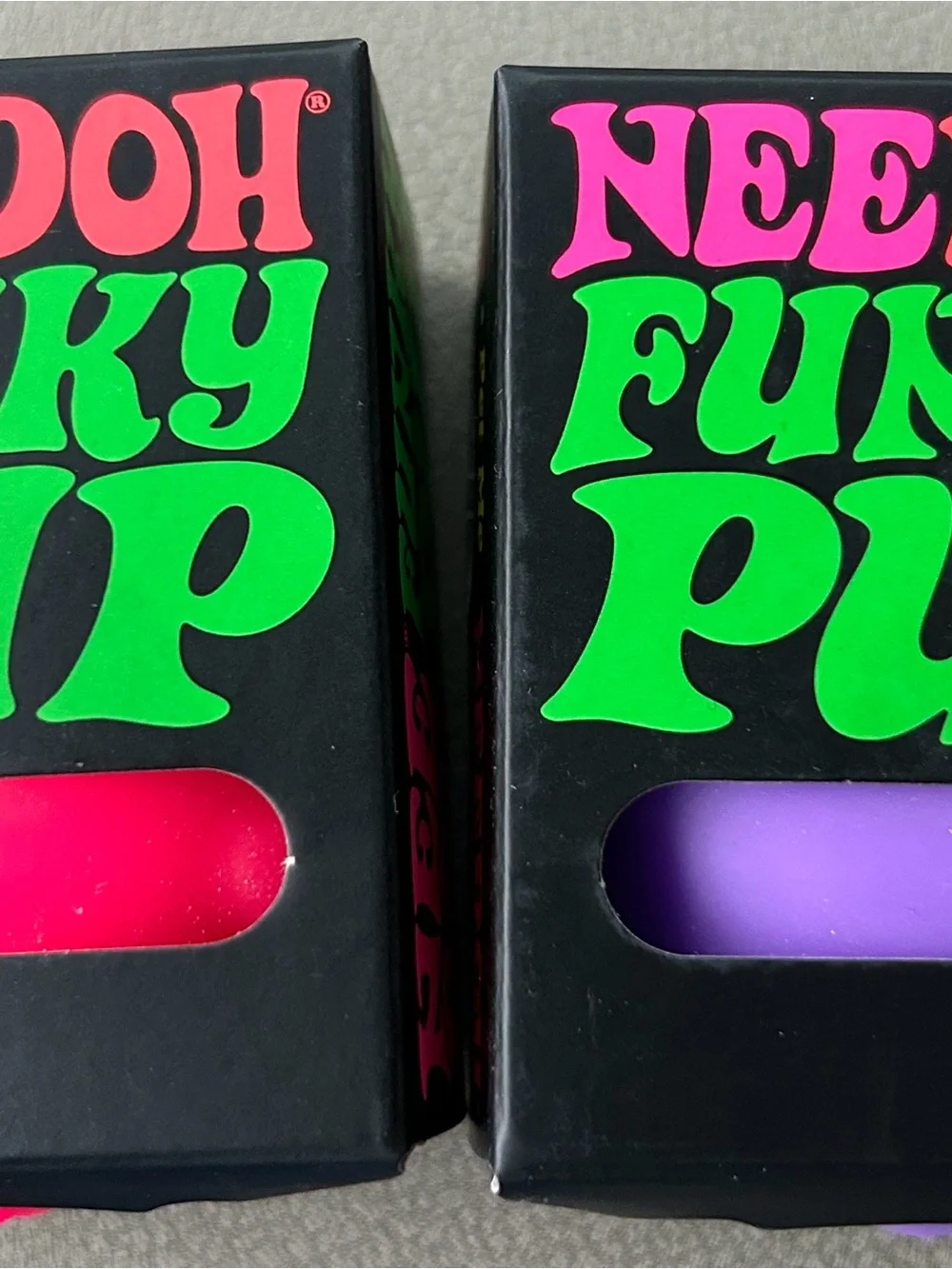 (2) Nee Doh Funky Pups.  Pink and Purple